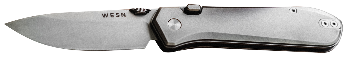 The WESN BOK in titanium, open, lying flat, cut out on a transparent background