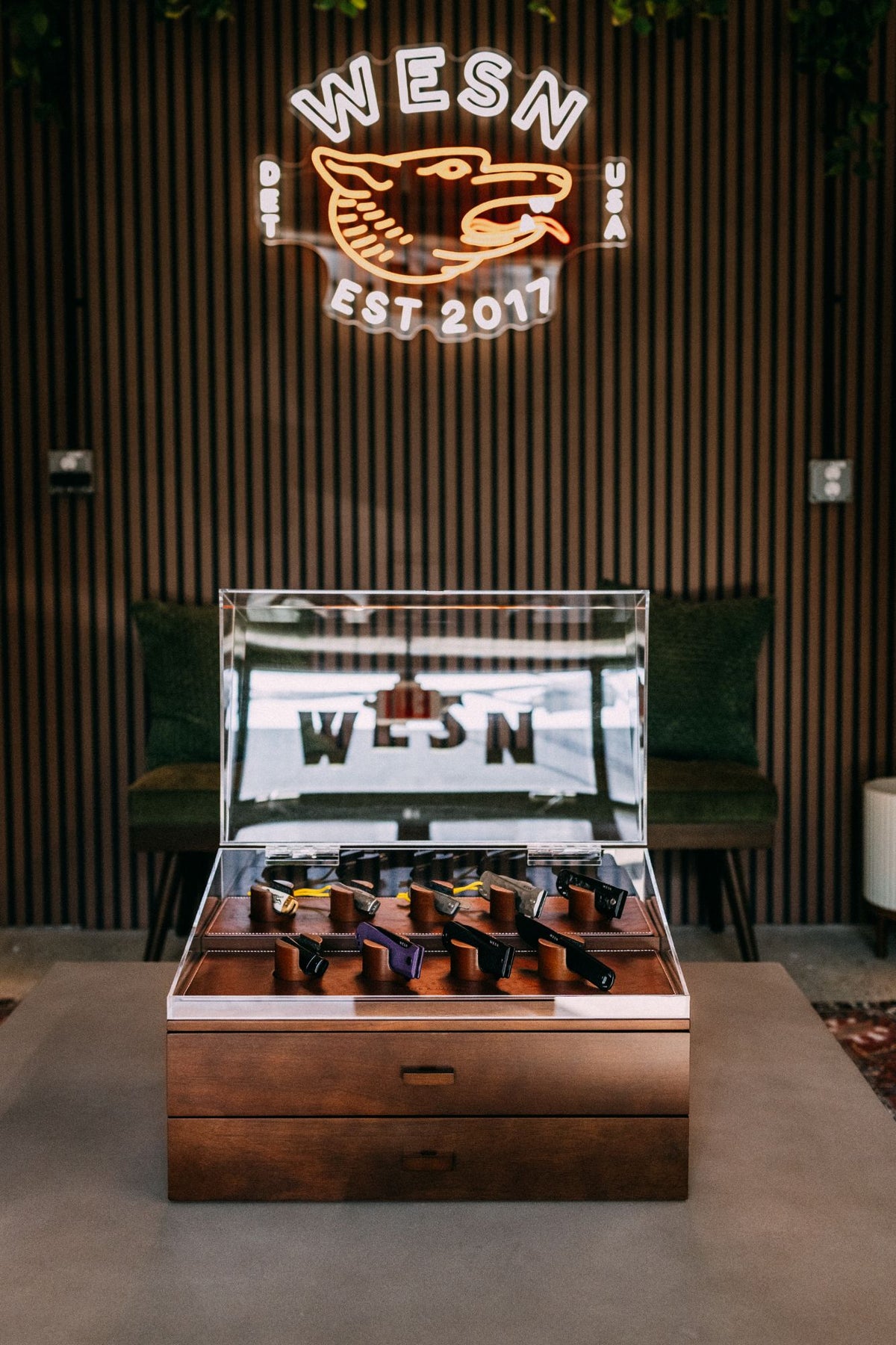 The Armada case on display at the WESN Detroit store under the neon sign