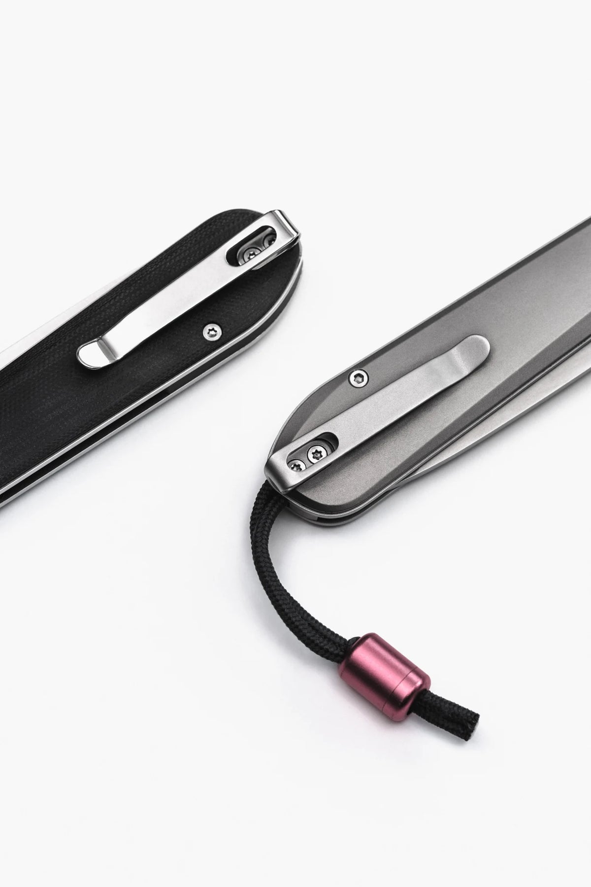 Titanium and Black G10 handles, with the internal lanyard attachment shown on the titanium BOK