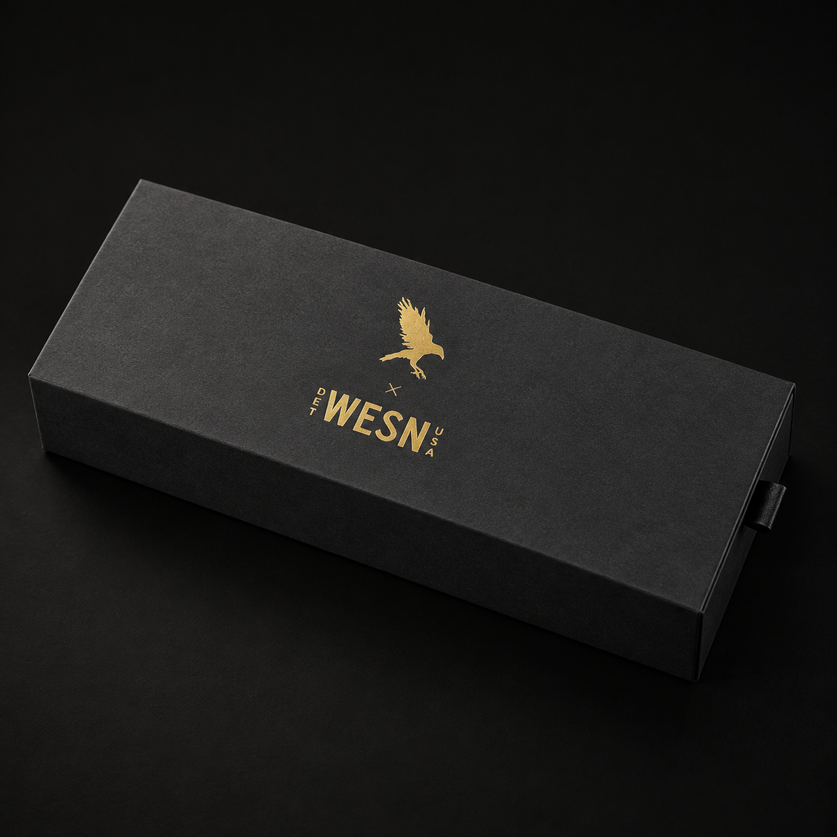 Raven’s Bornas custom matte black slider box with gold foil Raven and WESN artwork